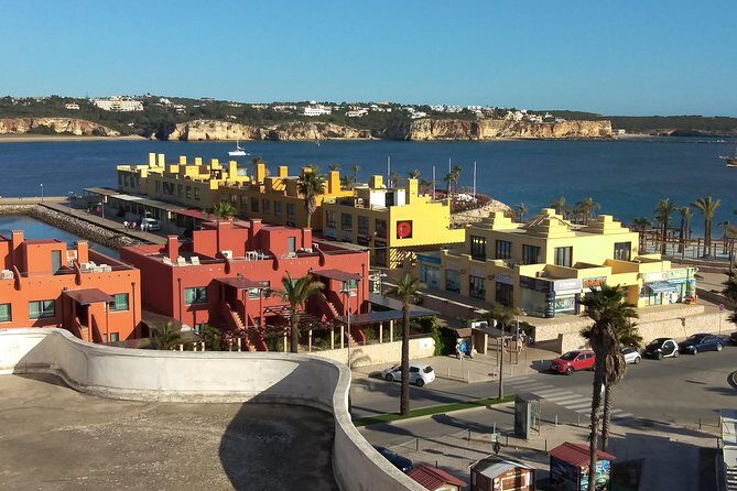 Discover Sagres & Lagos & Portimao ( Full Day Private Van Tour ) - Praia da Rocha and Portimão Marina: Sand, Forts, and Yachts in the Same Day